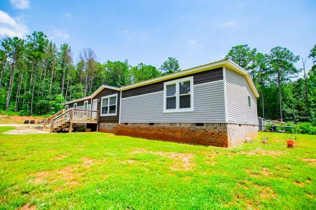 200 Duck Pond Road Roopville, GA 30170 - Photo 11 of 89 a view of a house with a yard and trees