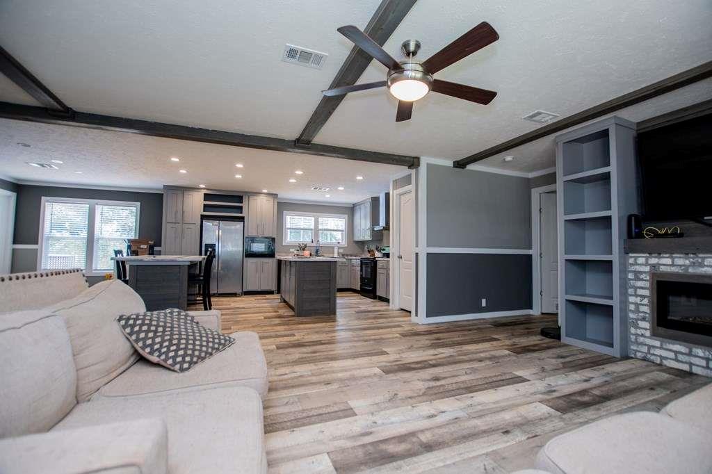 200 Duck Pond Road Roopville, GA 30170 - Photo 17 of 89 a living room with furniture a flat screen tv and kitchen view