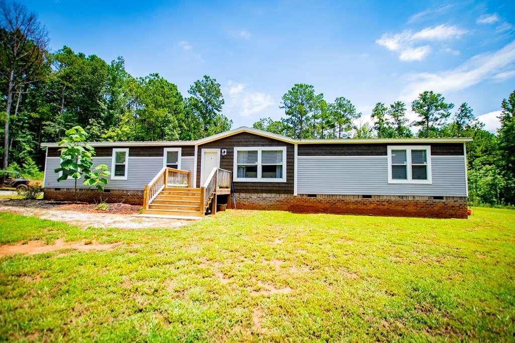 200 Duck Pond Road Roopville, GA 30170 - Photo 2 of 89 a view of a house with swimming pool and sitting area