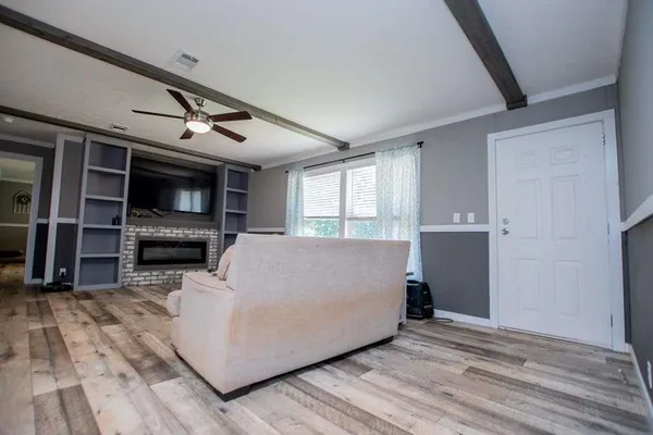 a kitchen with stainless steel appliances granite countertop a refrigerator a sink and a stove