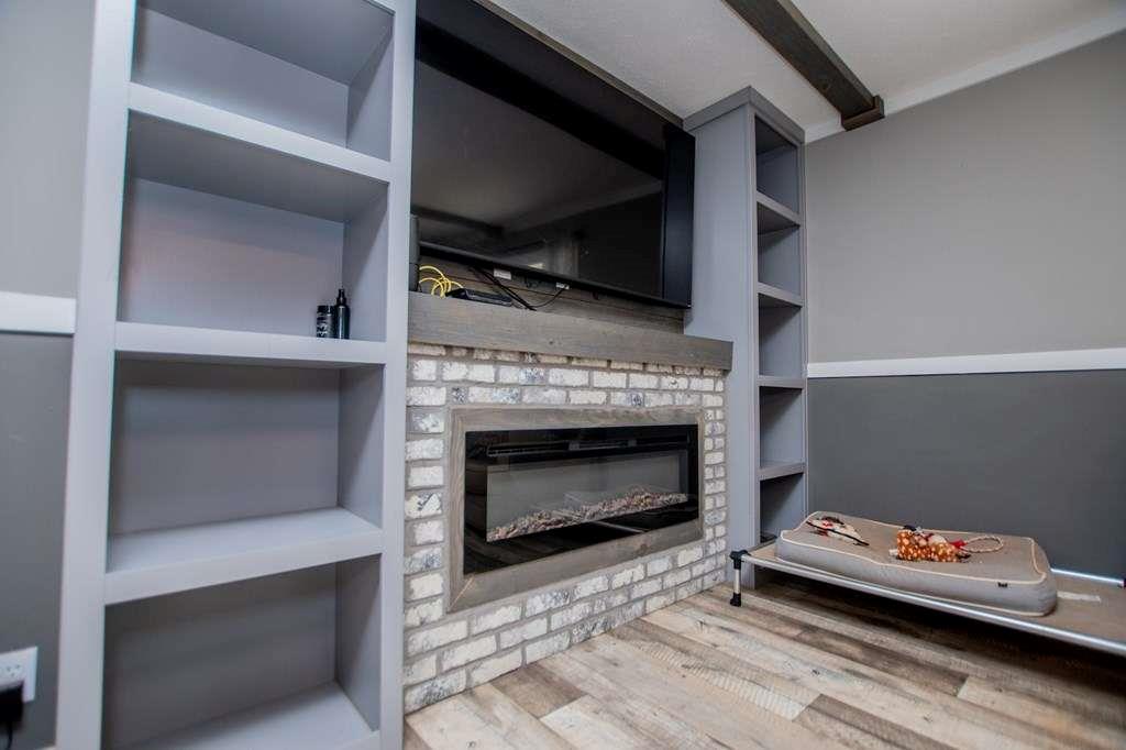 200 Duck Pond Road Roopville, GA 30170 - Photo 22 of 89 a living room with furniture and a fireplace