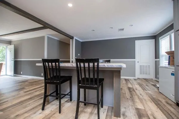a bathroom with a sink vanity and mirror