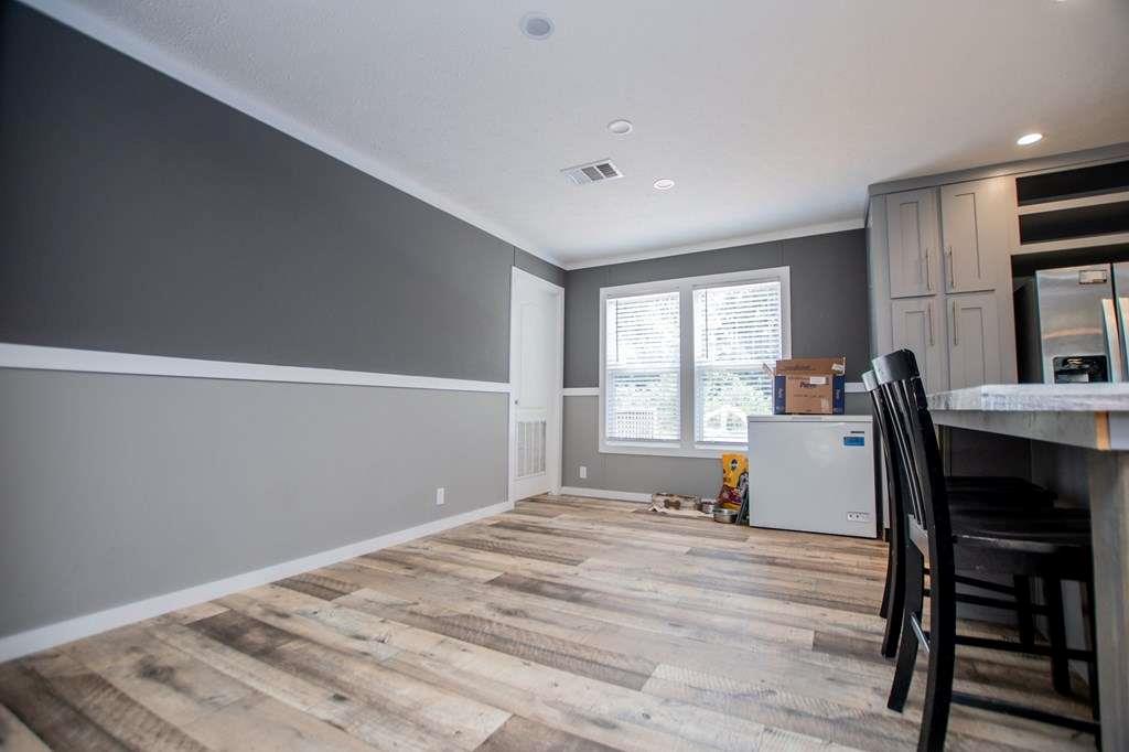 200 Duck Pond Road Roopville, GA 30170 - Photo 38 of 89 a bedroom with a bed and wooden floor