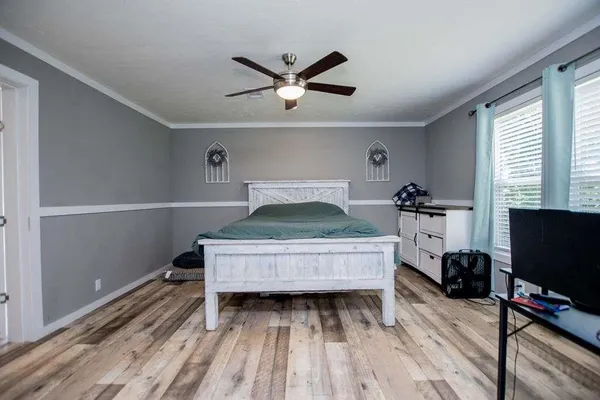 a view of backyard with swimming pool and green space