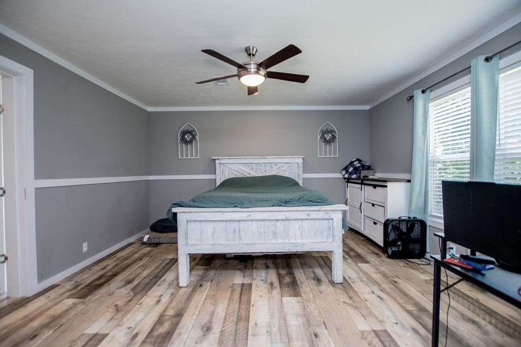 200 Duck Pond Road Roopville, GA 30170 - Photo 45 of 89 a living room with hard wood floors and a bed