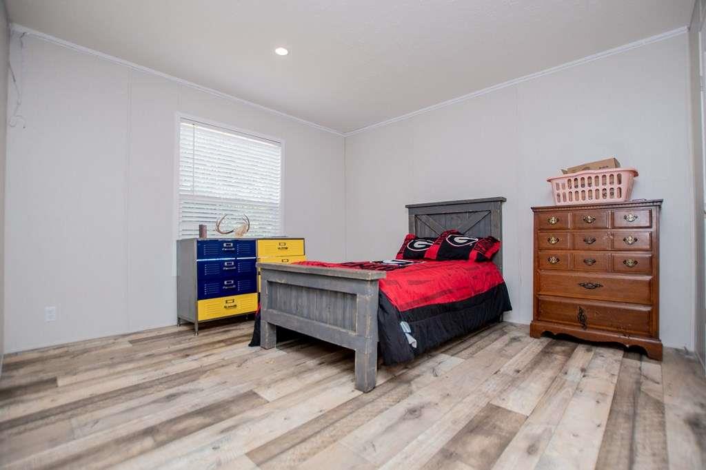 200 Duck Pond Road Roopville, GA 30170 - Photo 53 of 89 a bedroom with furniture and flat screen tv