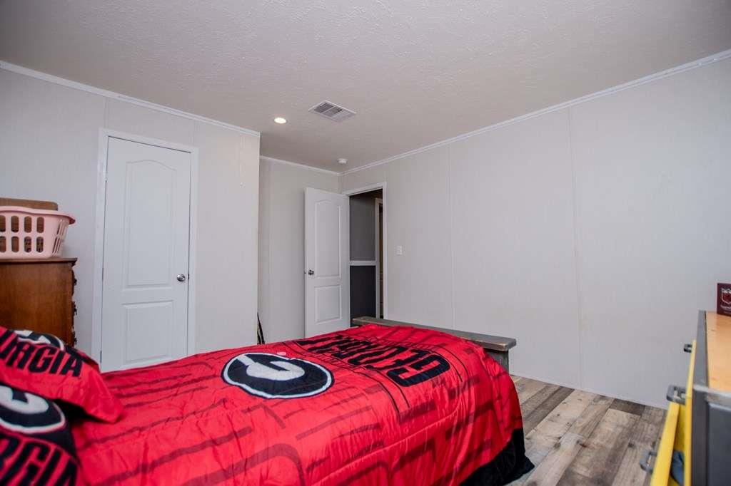 200 Duck Pond Road Roopville, GA 30170 - Photo 54 of 89 a bedroom with a bed and a closet