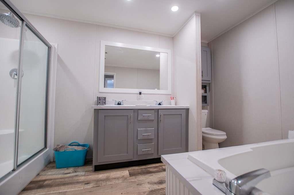 200 Duck Pond Road Roopville, GA 30170 - Photo 56 of 89 a bathroom with a sink a toilet and mirror