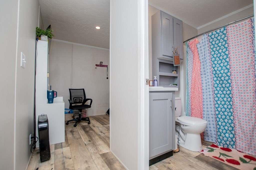 200 Duck Pond Road Roopville, GA 30170 - Photo 60 of 89 a bathroom with a sink toilet and shower