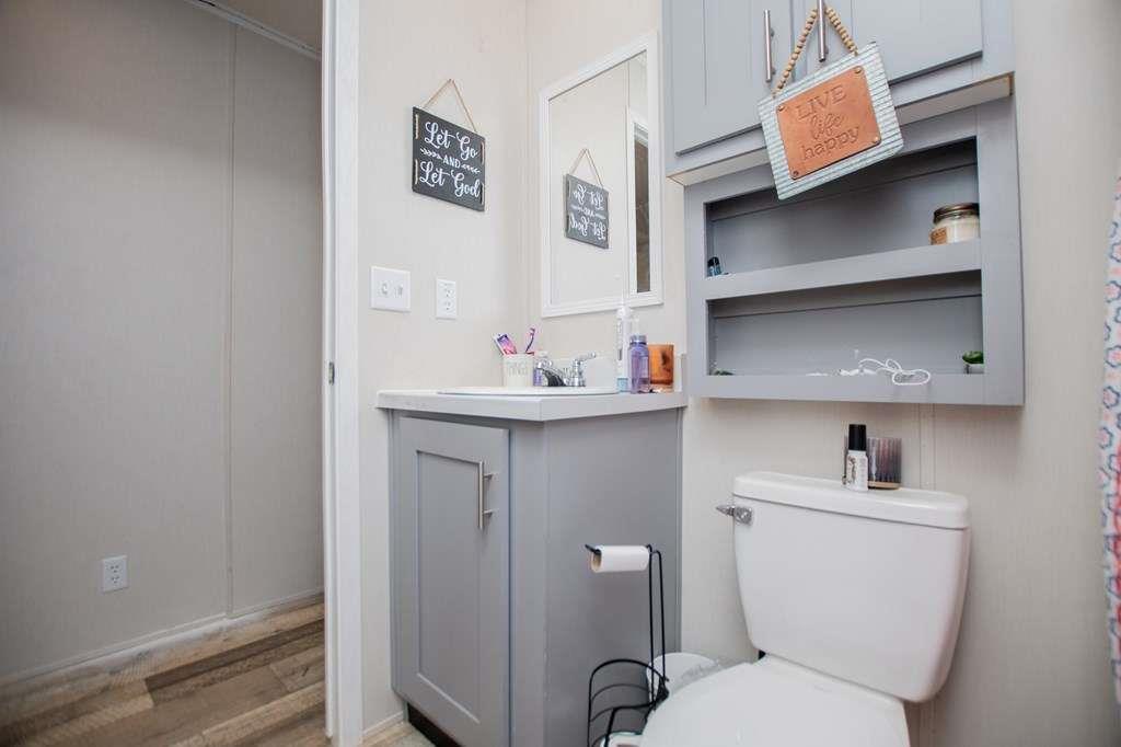 200 Duck Pond Road Roopville, GA 30170 - Photo 61 of 89 a bathroom with a sink toilet and vanity