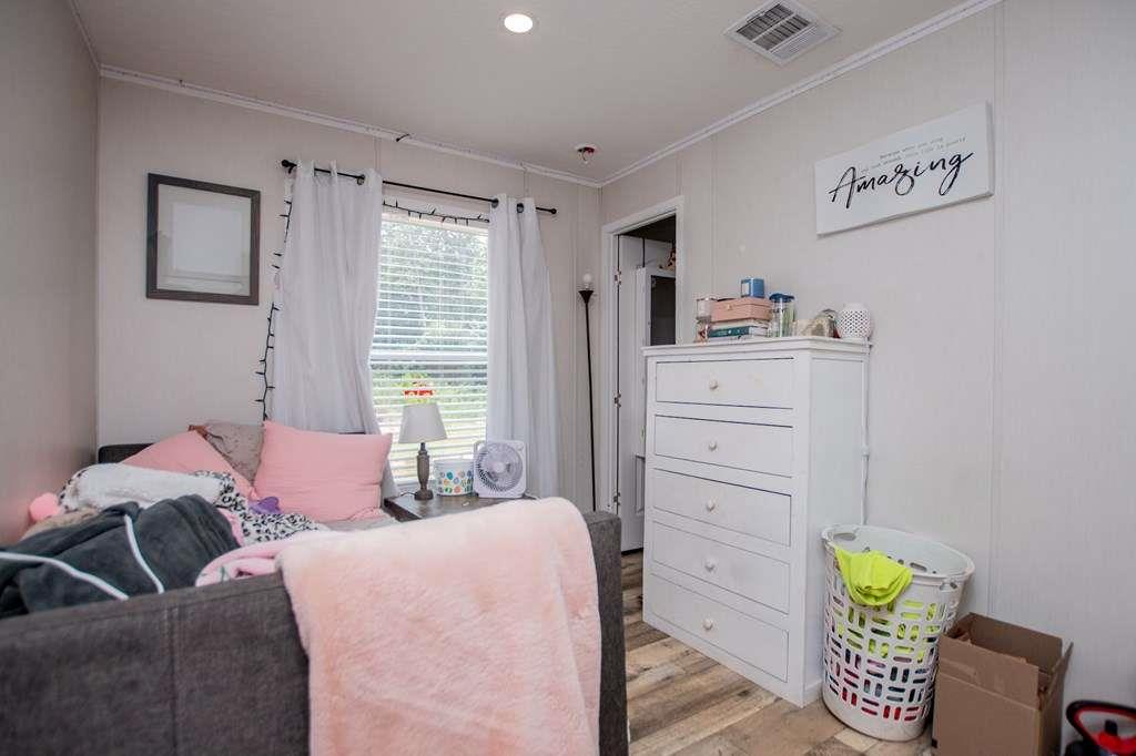 200 Duck Pond Road Roopville, GA 30170 - Photo 63 of 89 a bedroom with a bed and furniture