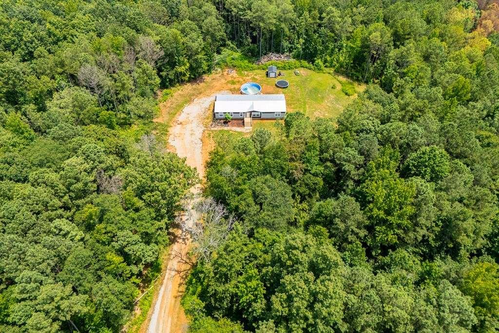 200 Duck Pond Road Roopville, GA 30170 - Photo 84 of 89 an aerial view of a house with a swimming pool and view