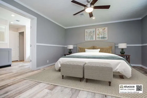 a living room with furniture a flat screen tv and kitchen view