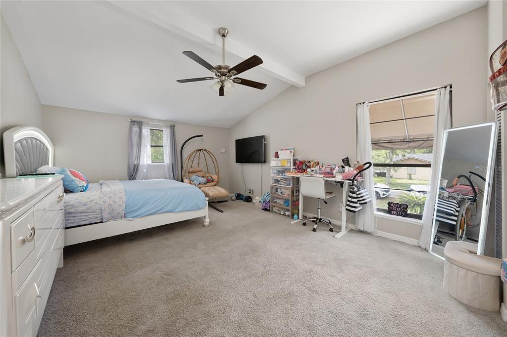 357 Ridgewood Street Altamonte Springs, FL 32701 - Photo 21 of 36 a bedroom with furniture and a flat screen tv