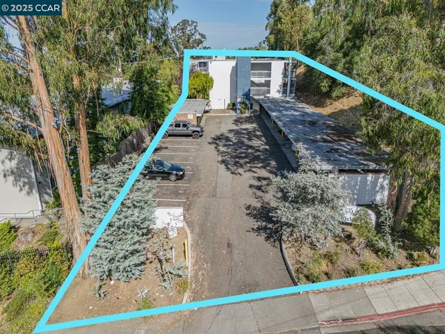 a view of a backyard with sitting area