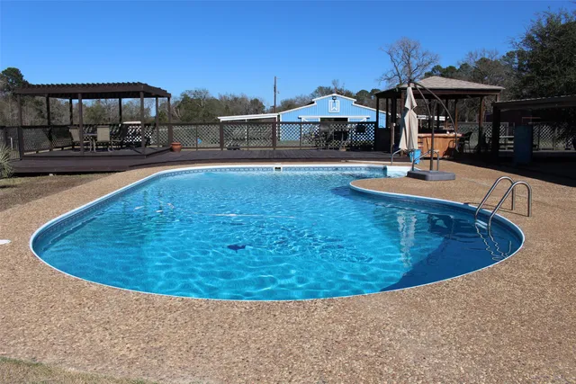 a view of a patio with a table chairs