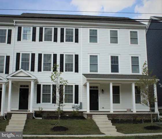 a front view of a brick building and chandelier