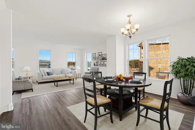 a view of a dining room with furniture and window