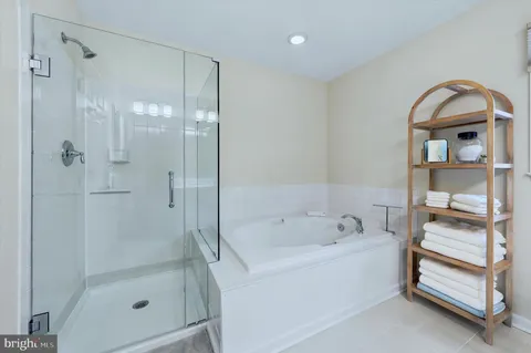 a bathroom with a bathtub and a shower