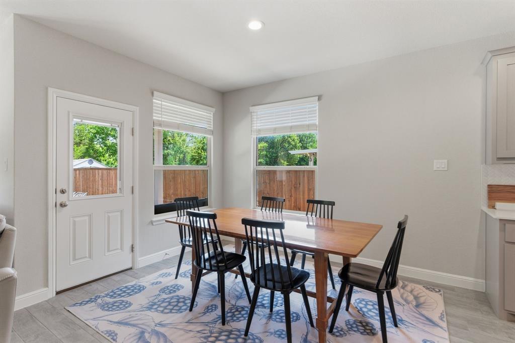 5621 Round Hl Road Denton, TX 76210 - Photo 9 of 27 a view of a dining room with furniture window and wooden floor