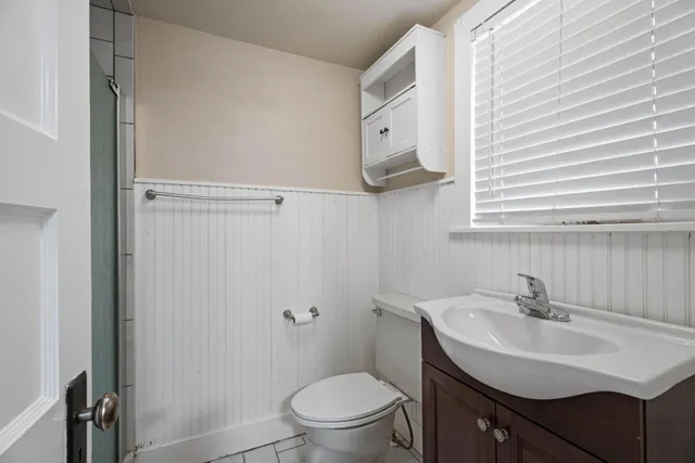 a bathroom with a sink toilet and vanity