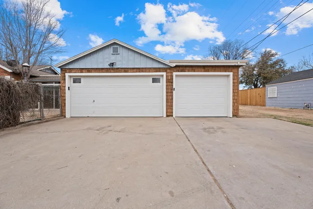 a view of garage and yard