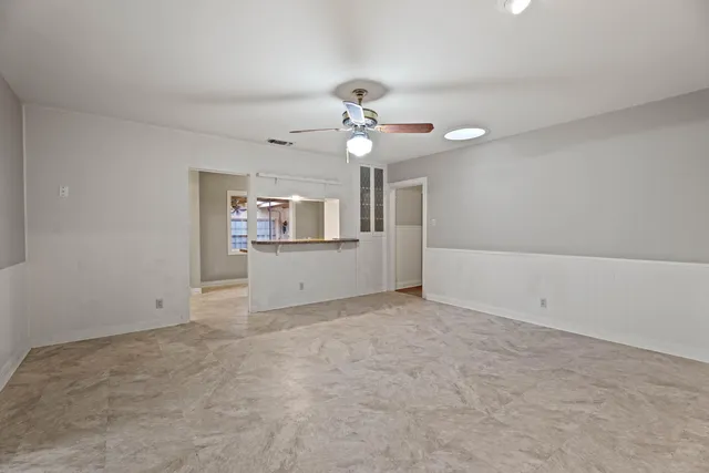 a view of an empty room with a window