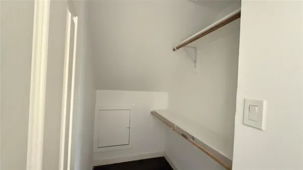 a view of entryway with wooden floor and stairs
