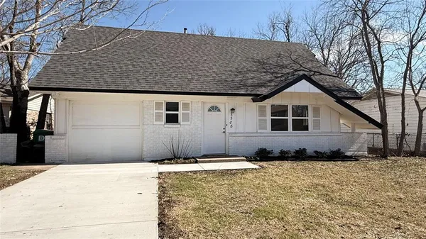 a view of a house with a snow in the yard