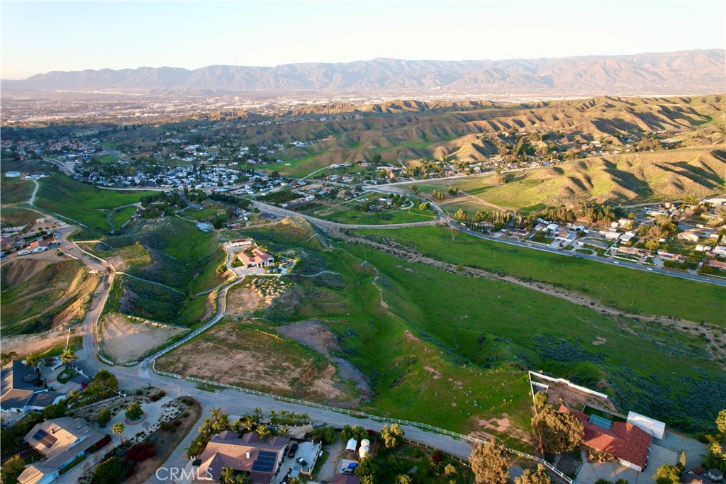 an aerial view of lake residential house with swimming pool and green space