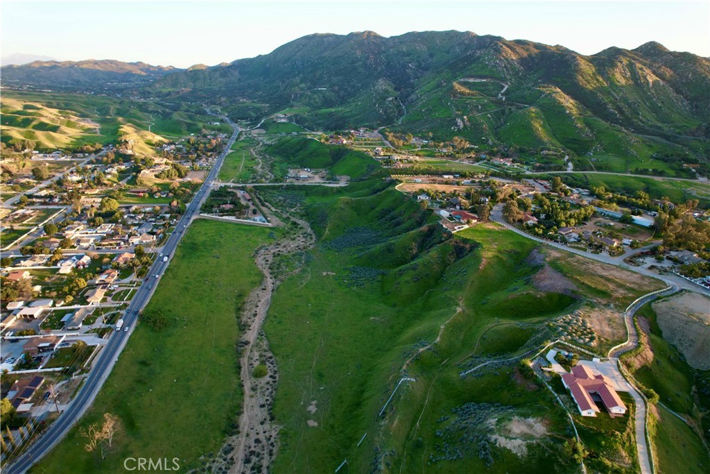 7260 Luane Trail Colton, CA 92324 - Photo 3 of 4 a view of a lush green hillside and a building
