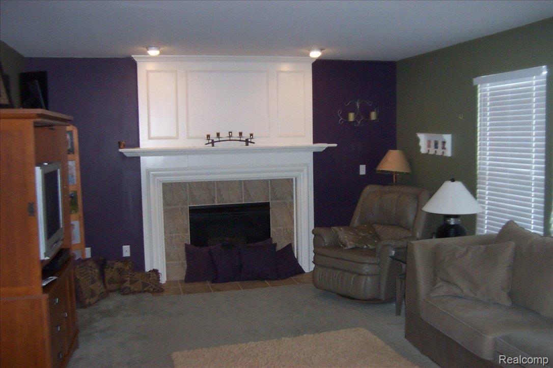1151 Callaway Court Howell, MI 48843 - Photo 12 of 14 family room with gas fireplace