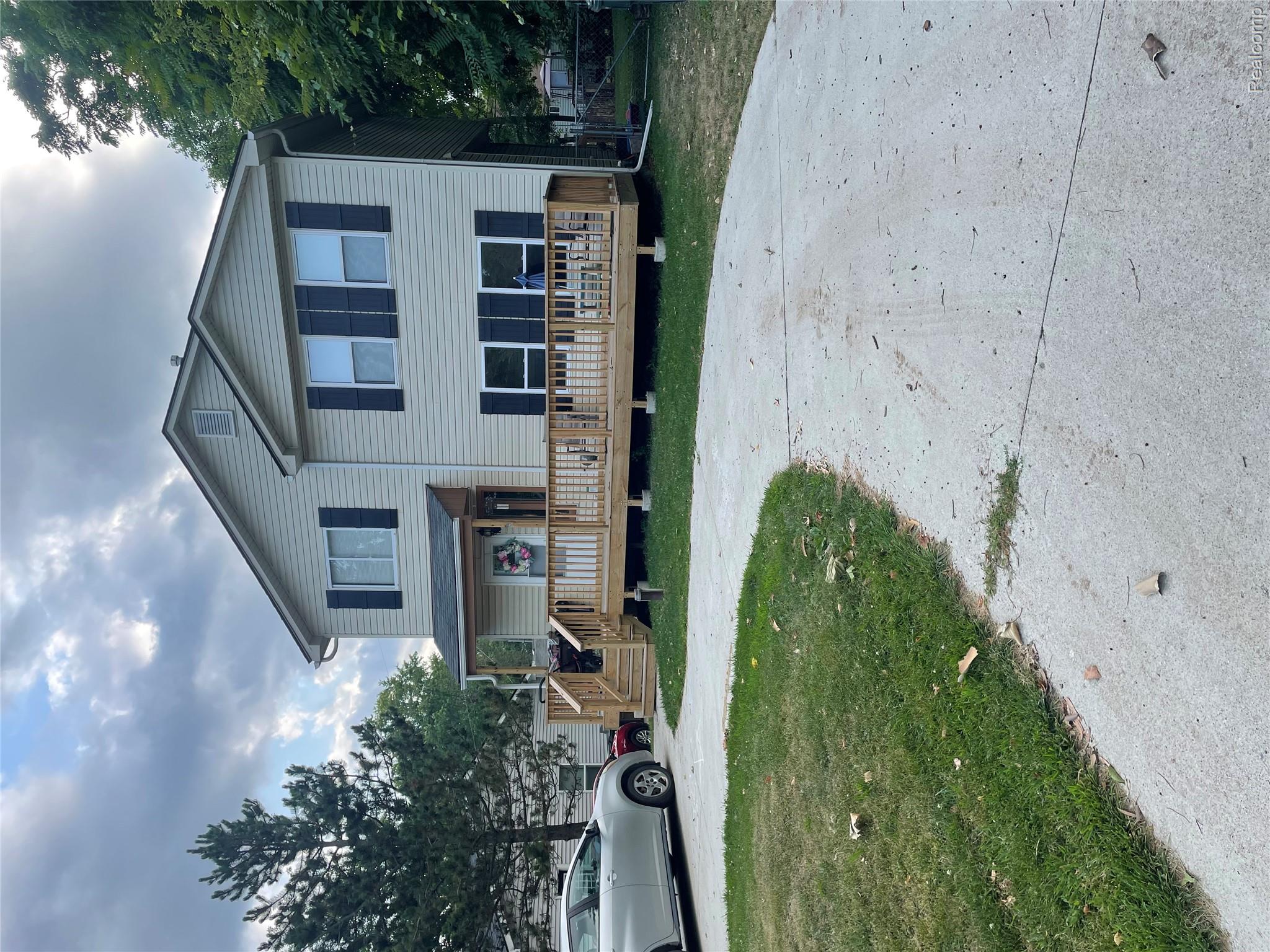 265 Reno Street Lake Orion, MI 48362 - Photo 1 of 11 Two-story residence featuring light-colored siding and dark window shutters