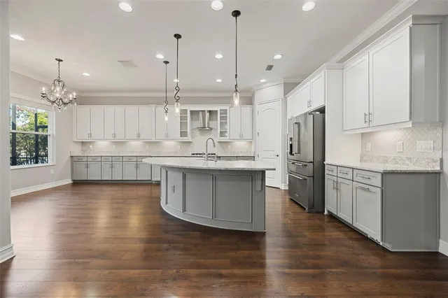 a stove top oven sitting inside of a kitchen