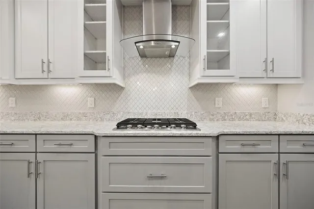 a view kitchen counter top space with granite countertop a sink and window