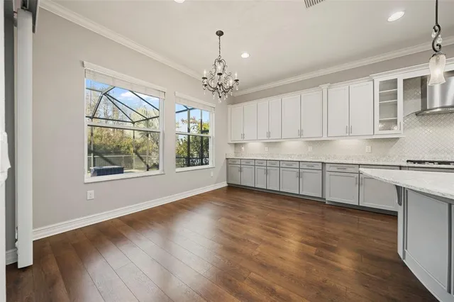 a bedroom with a bed potted plant and a window
