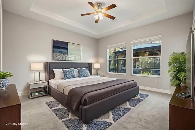 an empty room with a window and a ceiling fan