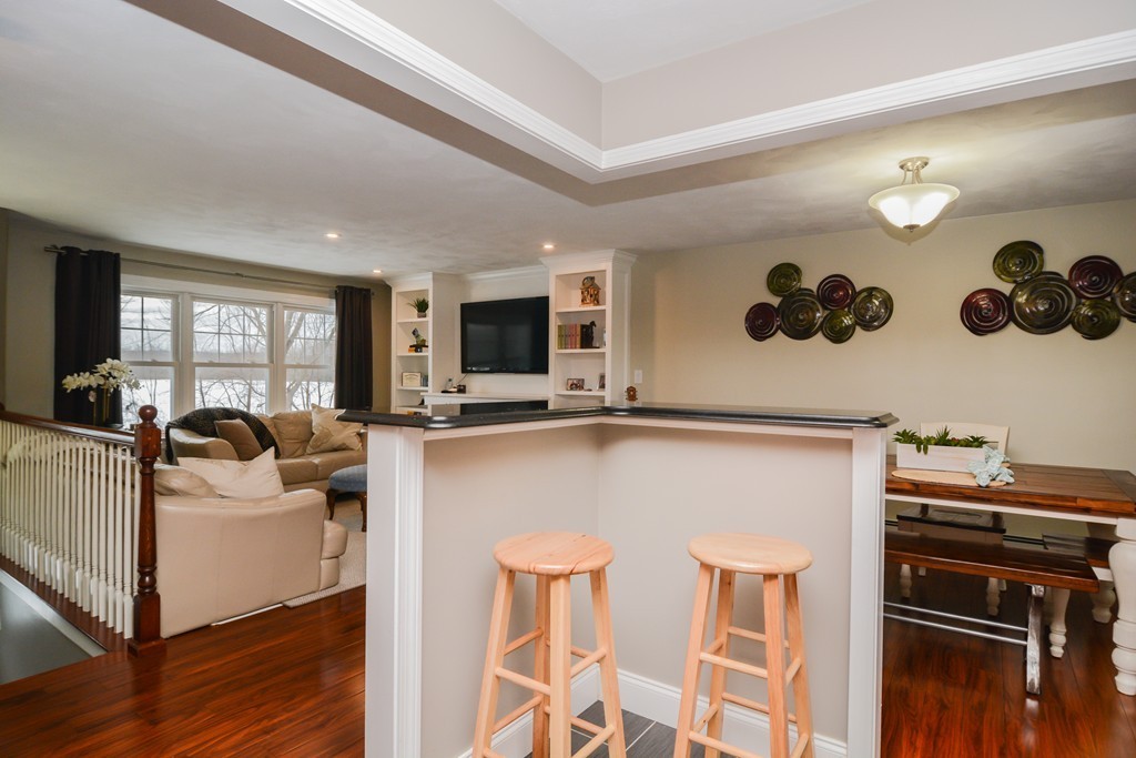 199 Center Bridge Road Lancaster, MA 01523 - Photo 11 of 30 a living room with furniture and a flat screen tv