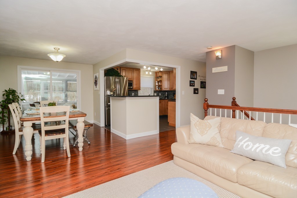 199 Center Bridge Road Lancaster, MA 01523 - Photo 12 of 30 a living room with furniture and a wooden floor