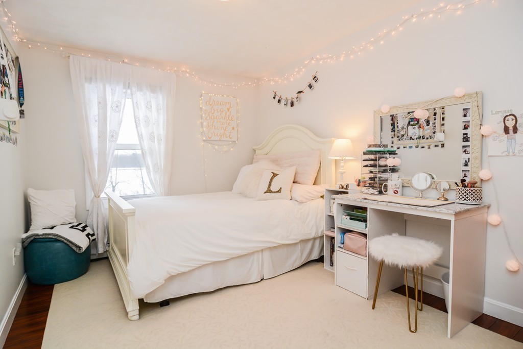 199 Center Bridge Road Lancaster, MA 01523 - Photo 15 of 30 a bedroom with a bed a table and chair
