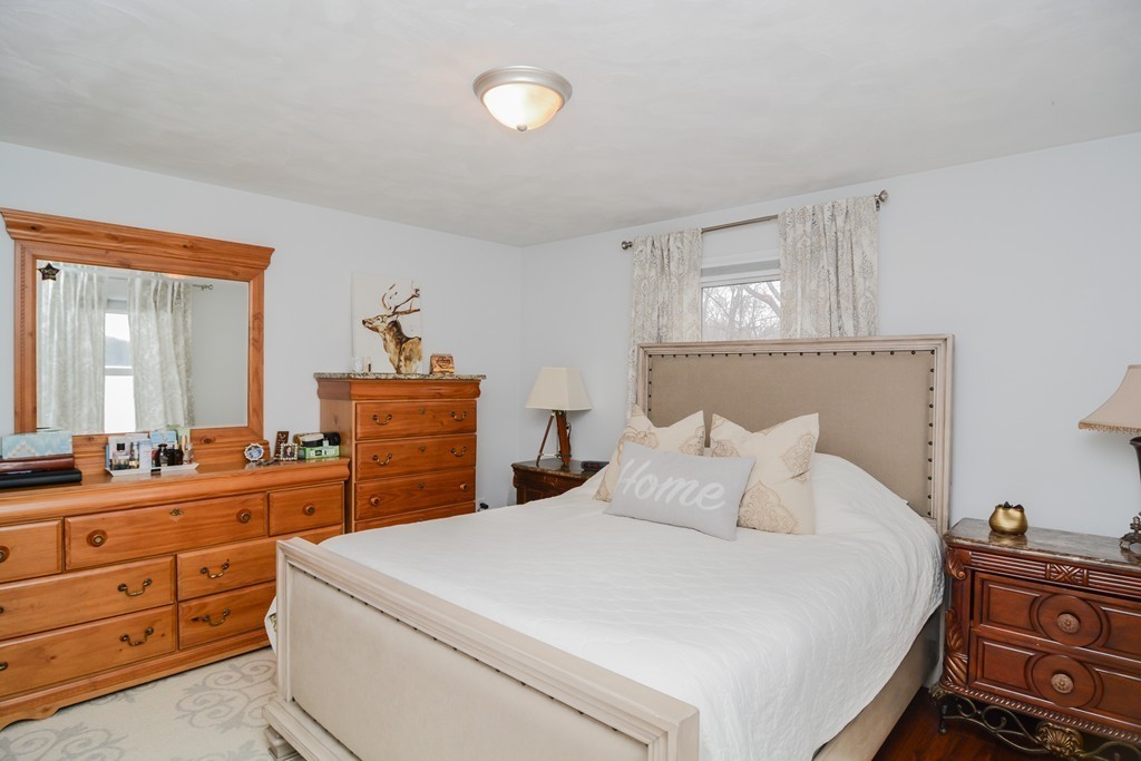 199 Center Bridge Road Lancaster, MA 01523 - Photo 20 of 30 a bedroom with a bed and a dresser