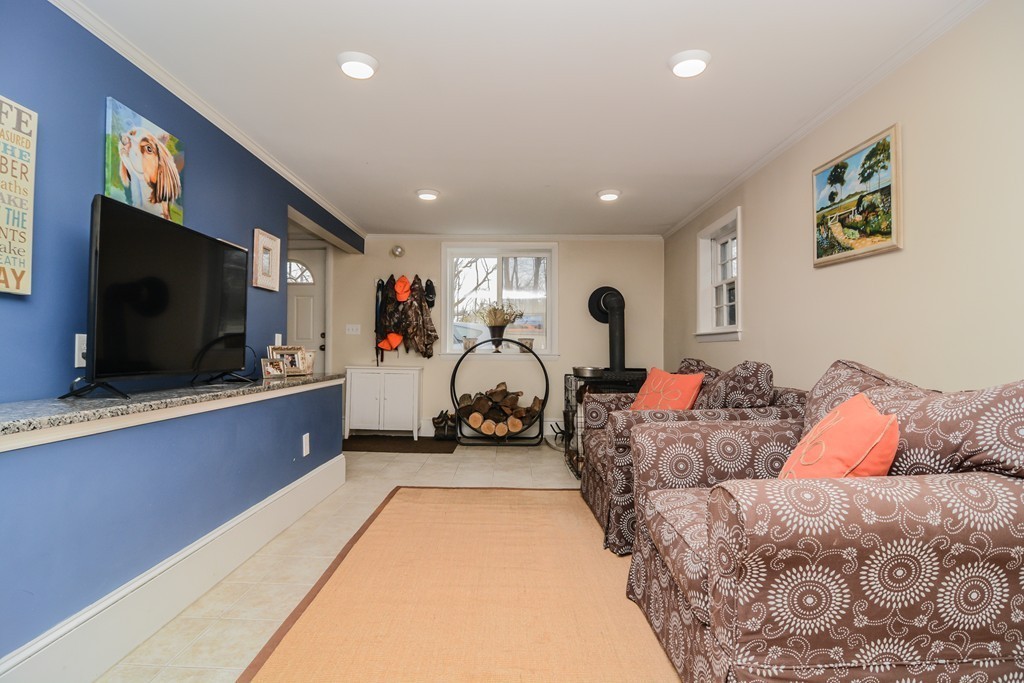 199 Center Bridge Road Lancaster, MA 01523 - Photo 25 of 30 a living room with furniture and a flat screen tv