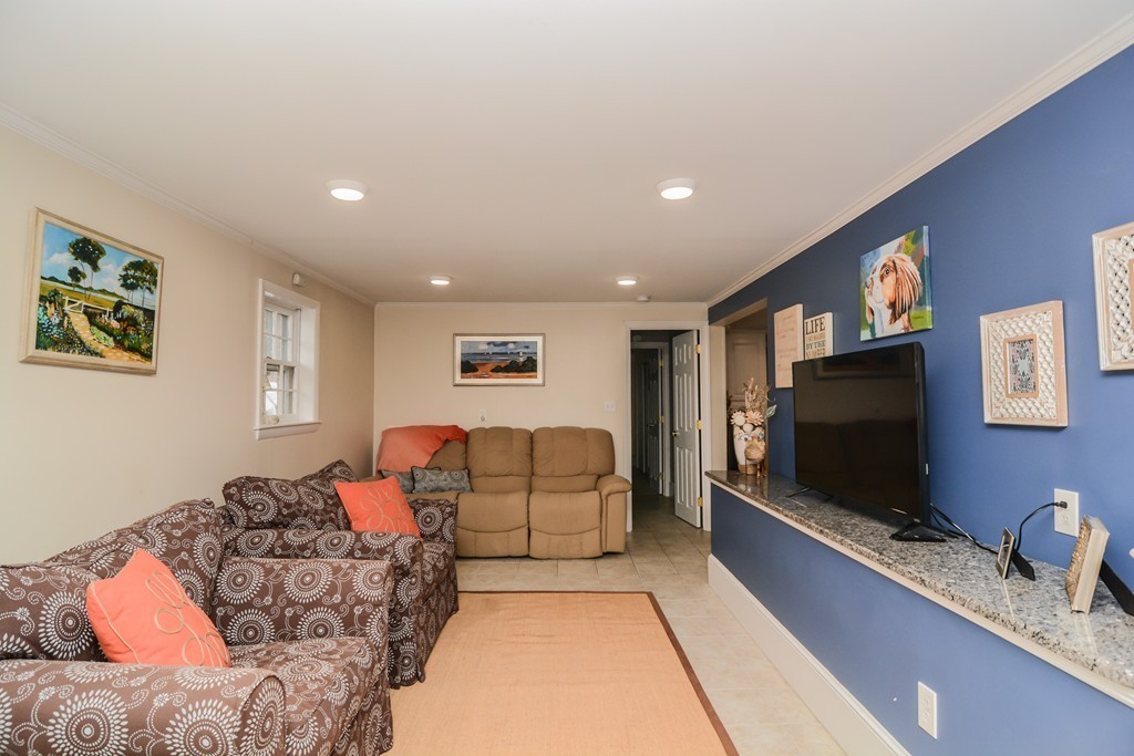 199 Center Bridge Road Lancaster, MA 01523 - Photo 26 of 30 a living room with furniture and a flat screen tv