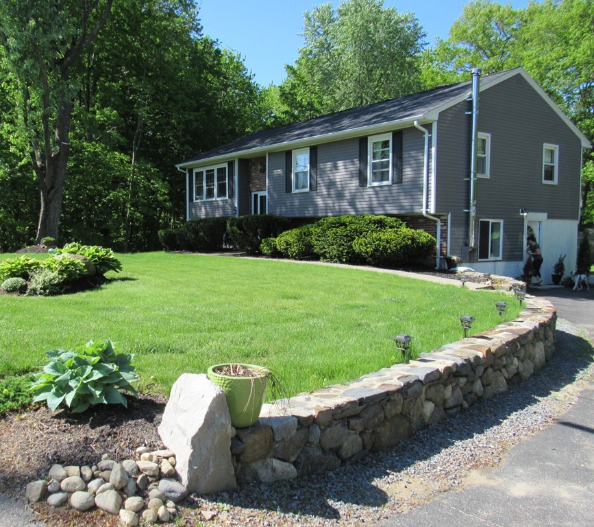 199 Center Bridge Road Lancaster, MA 01523 - Photo 3 of 30 a view of a house with backyard sitting area and garden