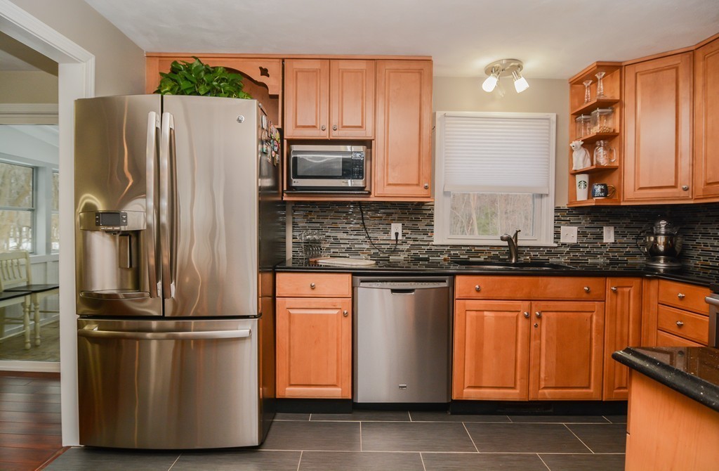199 Center Bridge Road Lancaster, MA 01523 - Photo 6 of 30 a kitchen with stainless steel appliances granite countertop a refrigerator and a stove