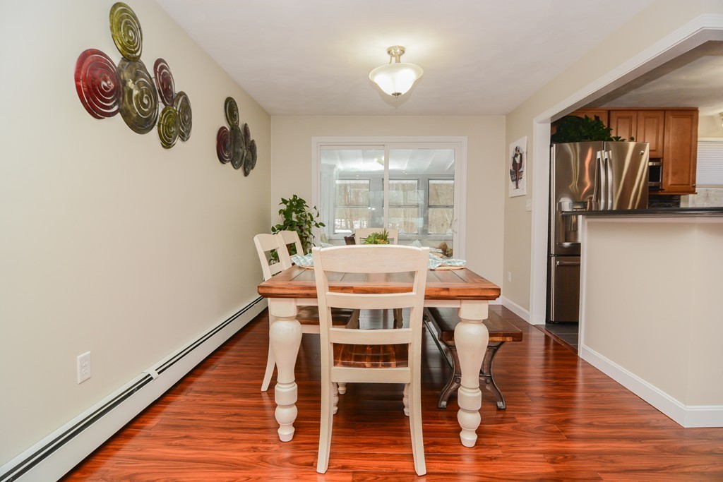 199 Center Bridge Road Lancaster, MA 01523 - Photo 8 of 30 a view of a dining room with furniture window and wooden floor