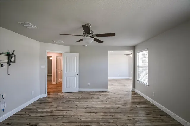 a view of an empty room with a window