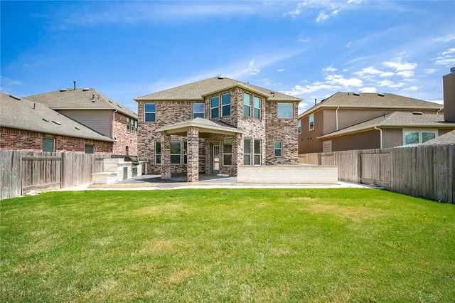a view of a house with a yard porch and sitting area