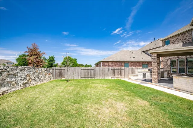 a view of a house with a yard porch and sitting area