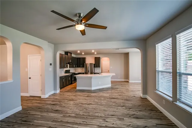 a view of kitchen with sink microwave and refrigerator